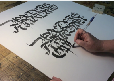 John Stevens showing how to write Fractur style of calligraphy with a broad brush