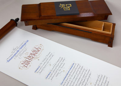 Documents in Calligraphy Hand made box and scroll. Document written on BFK Rives in ink, watercolor and 23k gold. Box is made of Mahogany, walnut and slate.