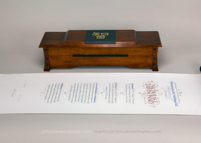 Documents in Calligraphy: Hand made box and scroll. Document written on BFK Rives in ink, watercolor and 23k gold. Box is made of Mahogany, walnut and slate.