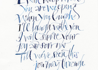 calligraphy in blue on white paper