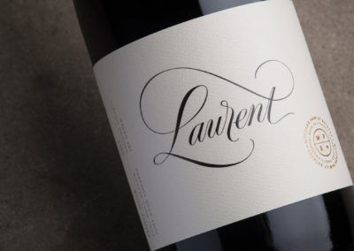 Calligraphy and Lettering by John Stevens applied to wine bottle.