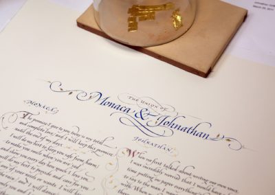 John Stevens Calligraphy working on marriage vows; handwritten on handmade paper with gold leaf
