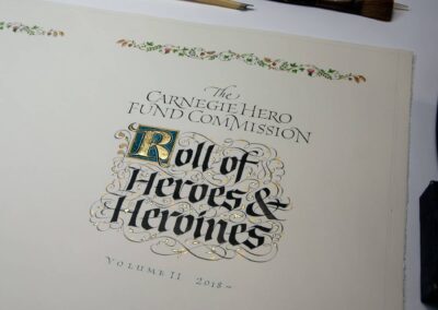 A calligraphic title page for the Carnegie Hero Fund in Gothic & flourished lettering. With 23k gold leaf.