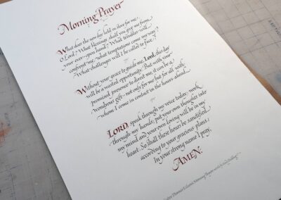 MorningPrayer-in calligraphy in Italic font on paper. Enhanced capitals with gold leaf accents