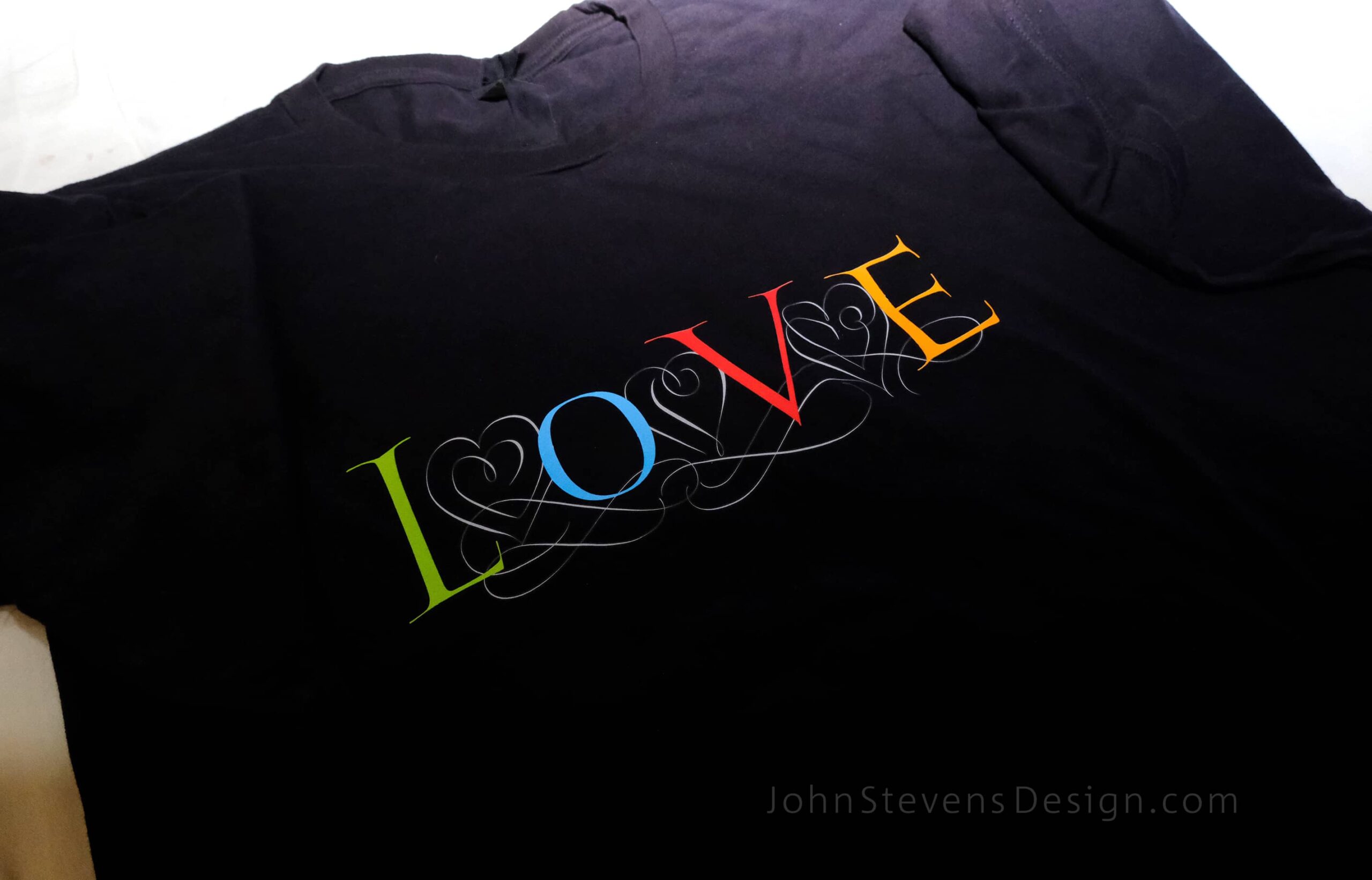 "Love" tshirt, calligraphed by John Stevens in 5 colors